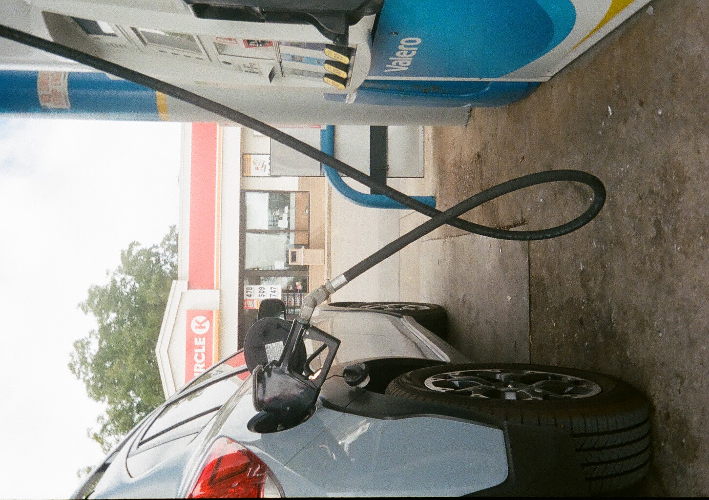 A close-up of the gas pump filling up our car